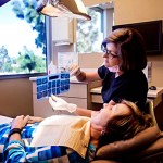 staff member showing patient his x-rays
